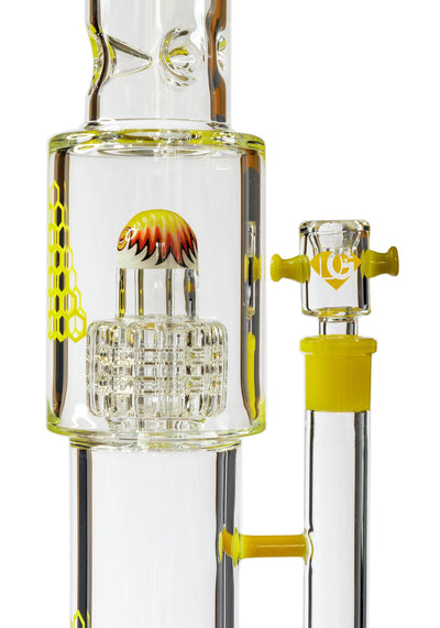 Detail view of the yellow wig-wag percolator cap and 18mm glass slide handle on a Diamond Glass water pipe